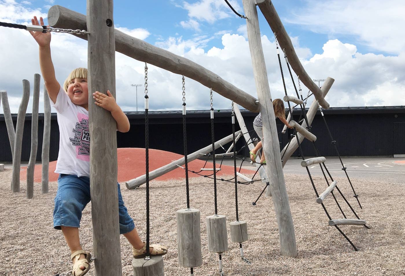 Opinmäki campus playground kids playing Opinmäki campus playground kids playing